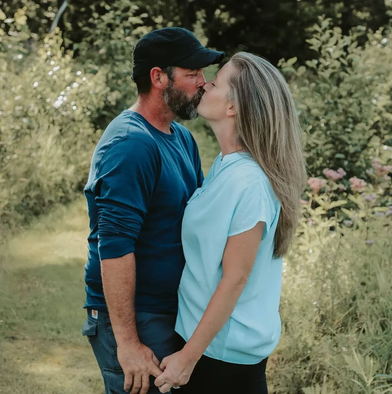 Maria Carlson Noel from VT embracing her husband.